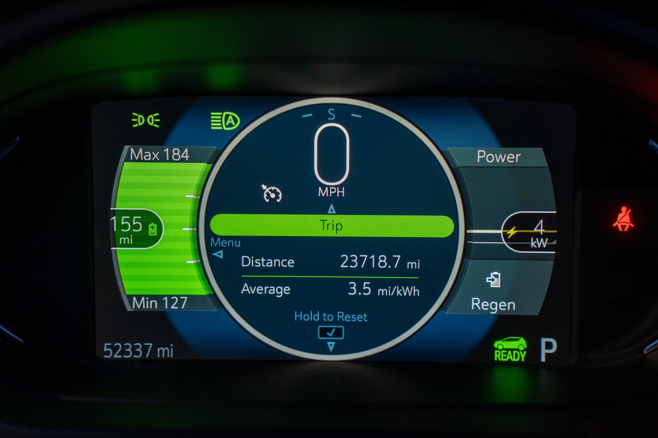 Electric vehicle dashboard showing battery range and charge level