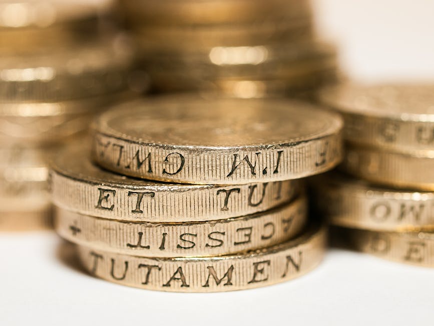 Stacked British pound coins representing UK pension savings