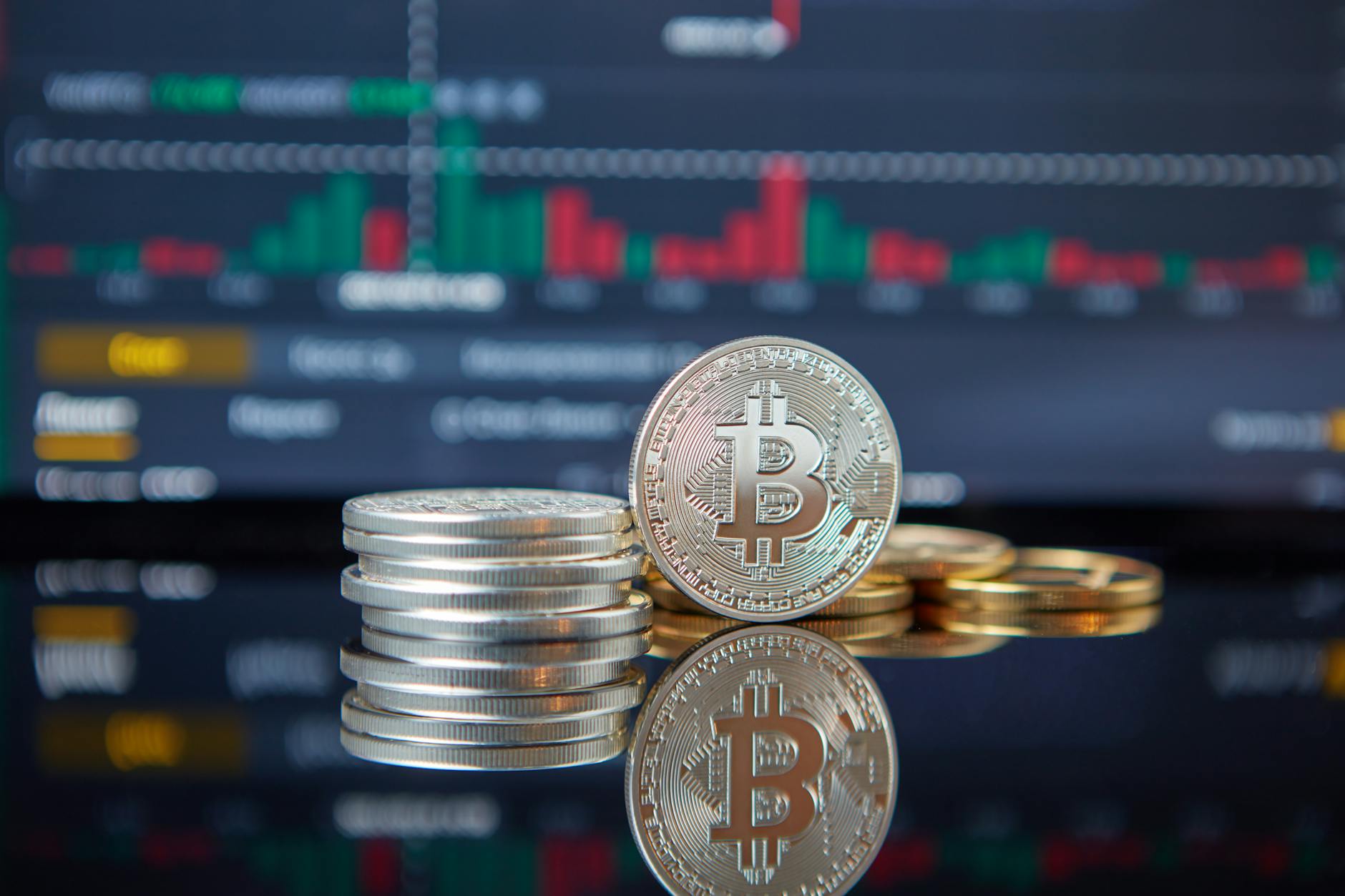 Bitcoin coins on a laptop keyboard representing crypto ETF investment products