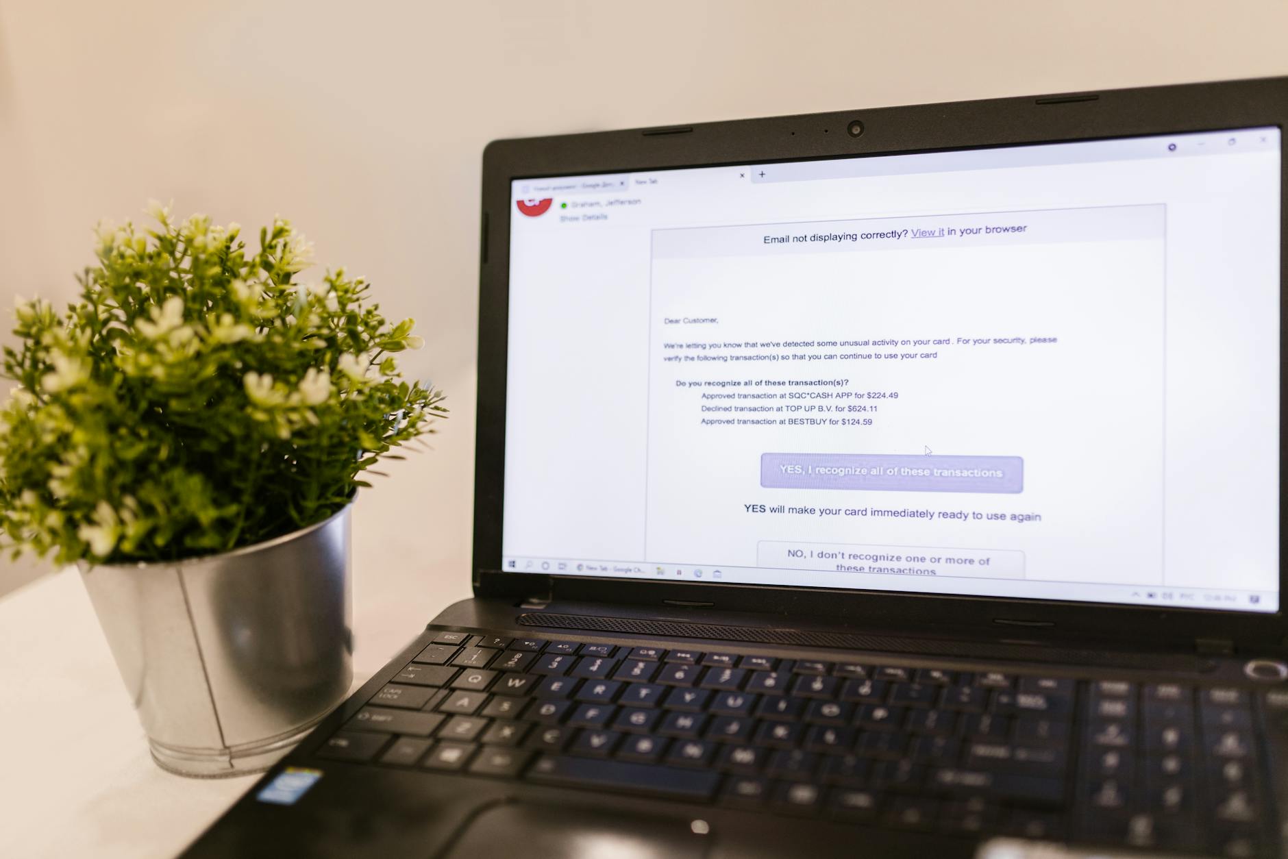 Person checking email on laptop screen