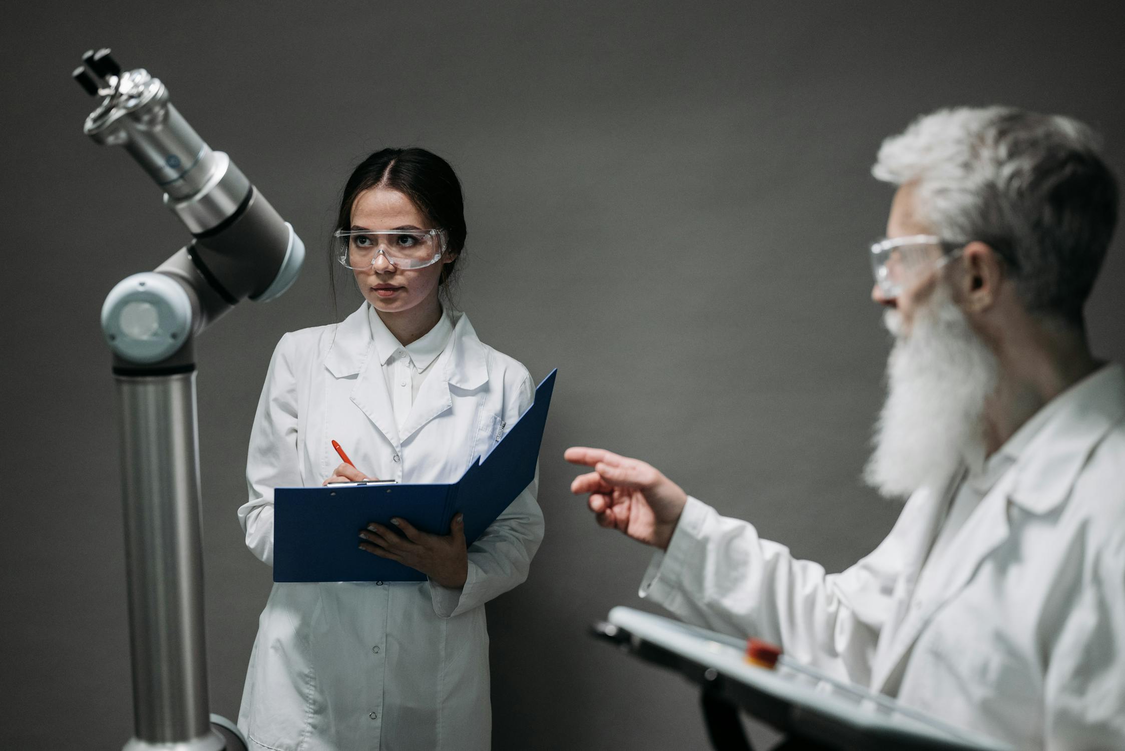 Scientists working on advanced robotics illustrating AI safety research challenges