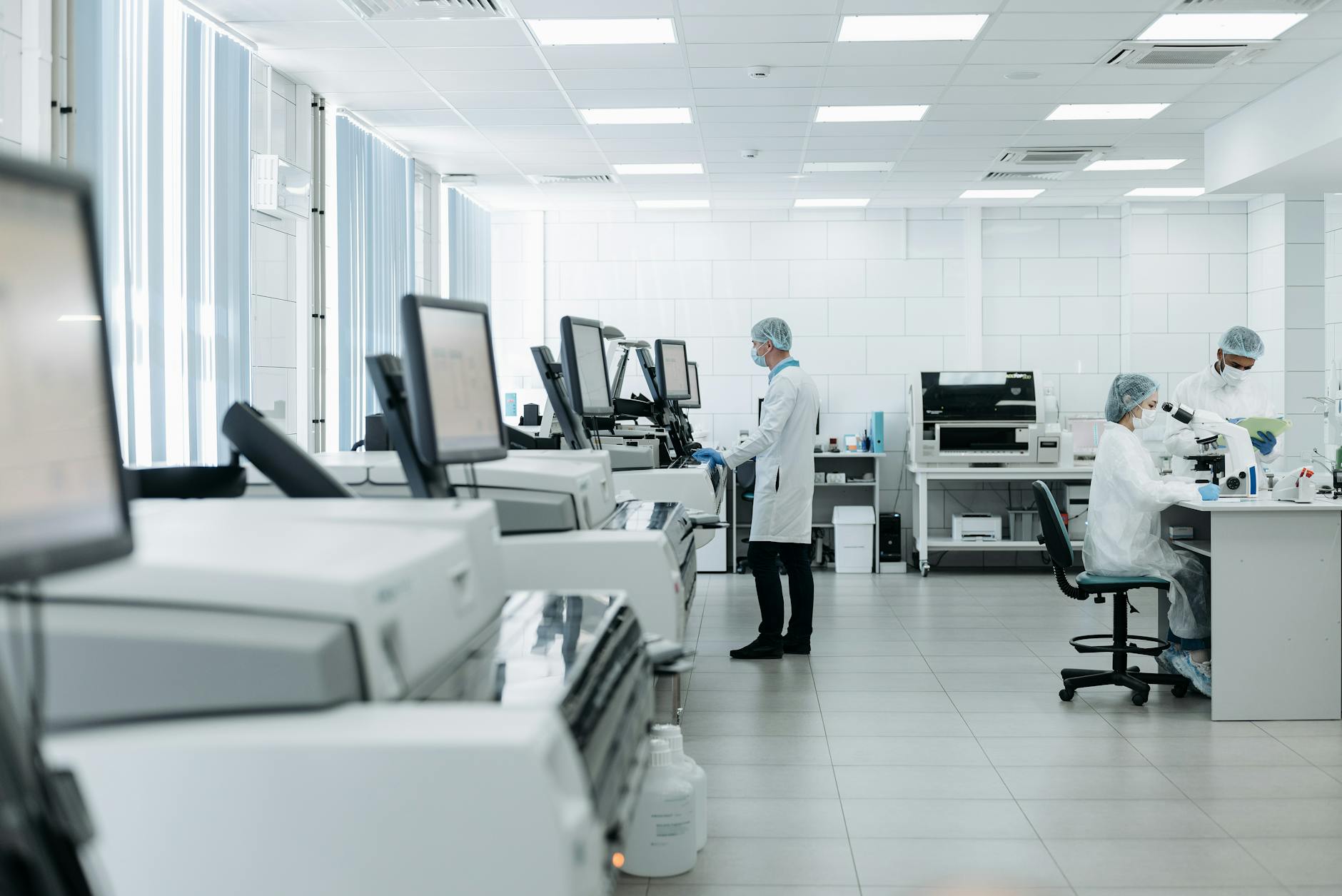 Research scientists working with technology in a laboratory setting