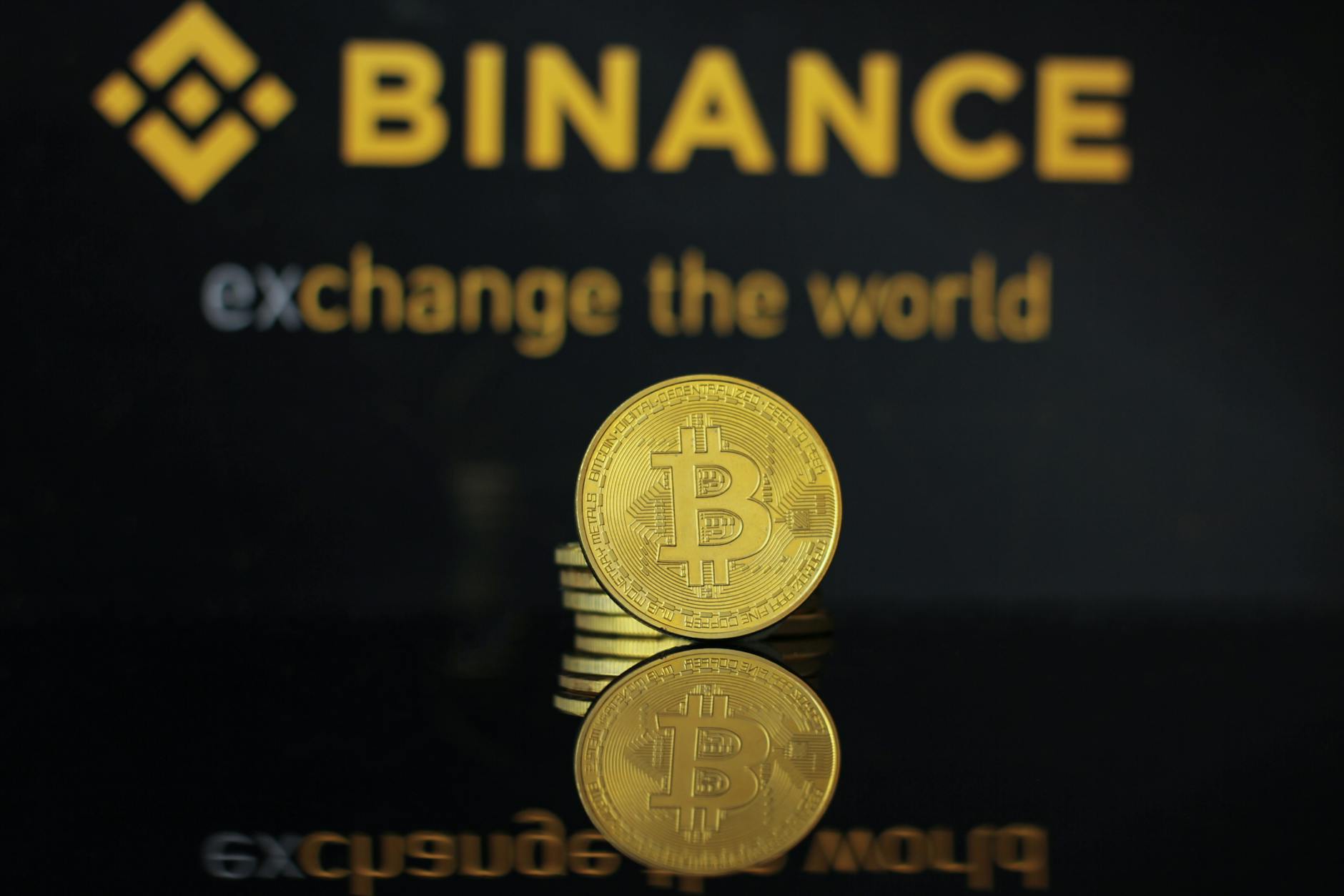Bitcoin symbol over financial chart