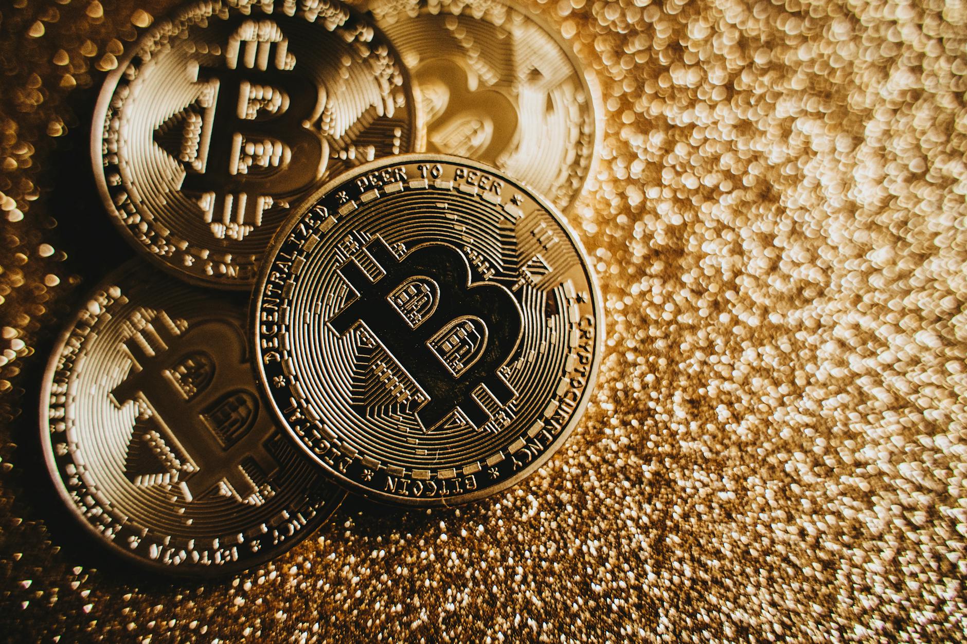Physical Bitcoin coin on dark background illustrating what is cryptocurrency