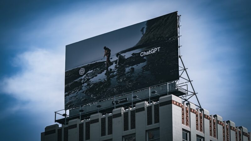Outdoor billboard displaying a ChatGPT advert above a building