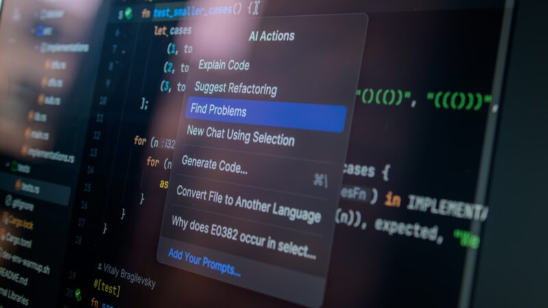 AI actions menu over code on a computer screen