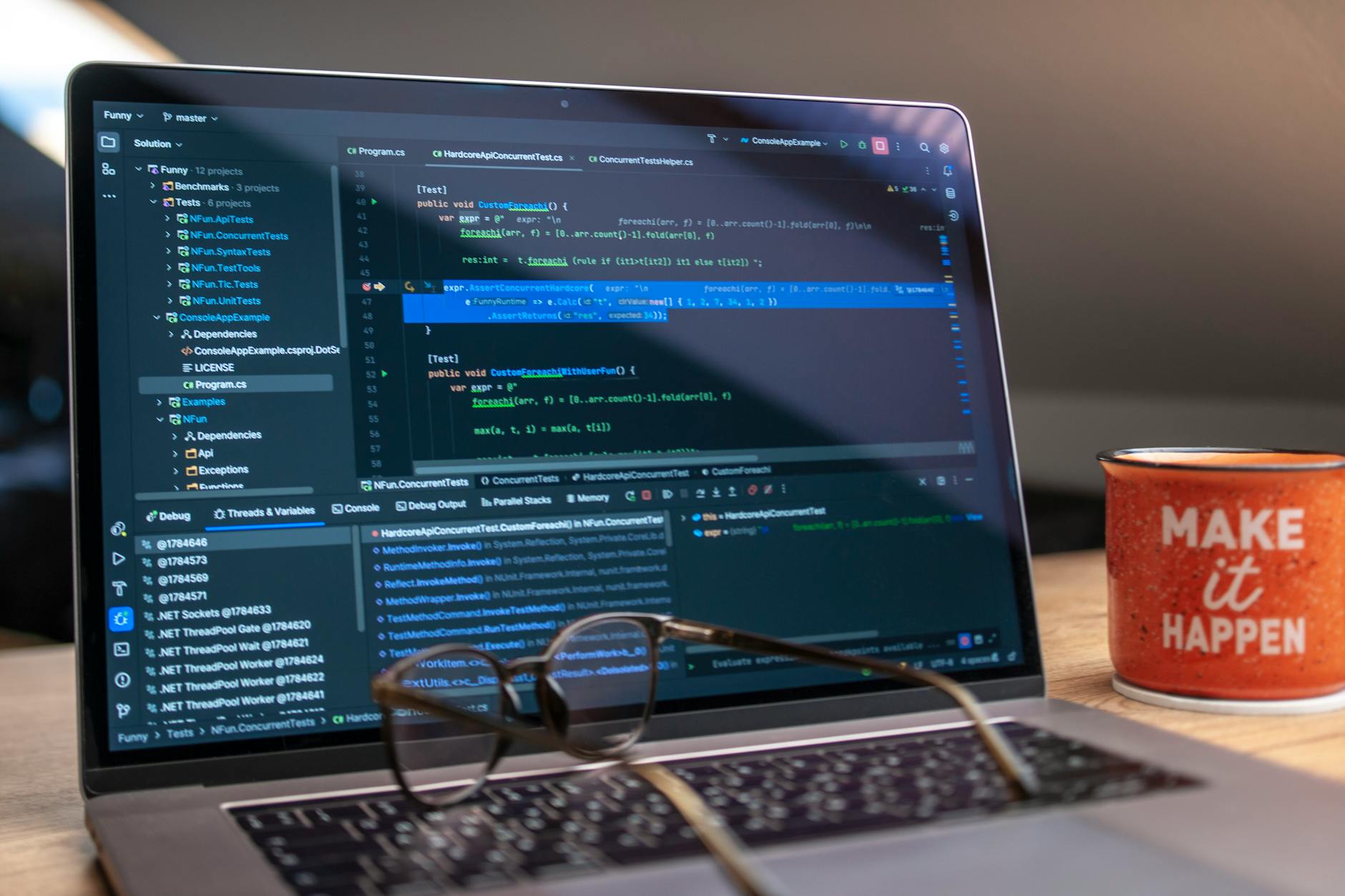 Developer working on a laptop with code on screen