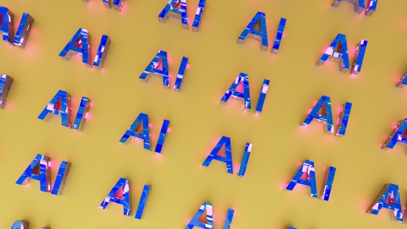 Blue AI letters repeated on a yellow background