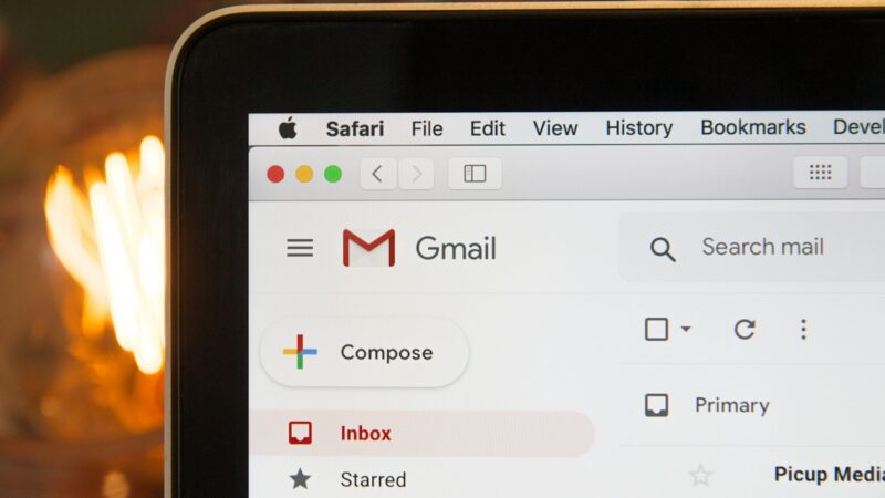 Secure email account shown with two-factor authentication prompt and strong padlock icon on a laptop