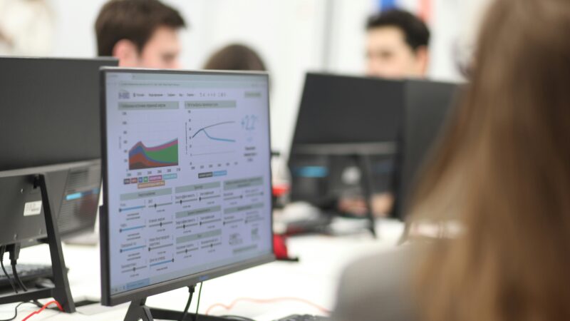 Top-slicing explained concept showing an investor reviewing portfolio profit levels