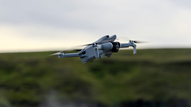 Drone technology in the UK: consumer drone in flight over a UK landscape