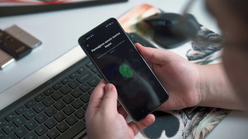 Passkeys explained concept showing a phone unlocking with biometric authentication instead of a password