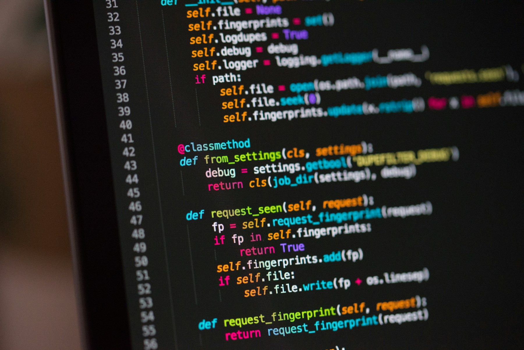 Developer workspace showing code on a laptop
