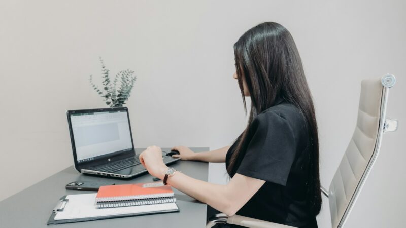 Person using AI for spreadsheets on a laptop with Excel and data on screen