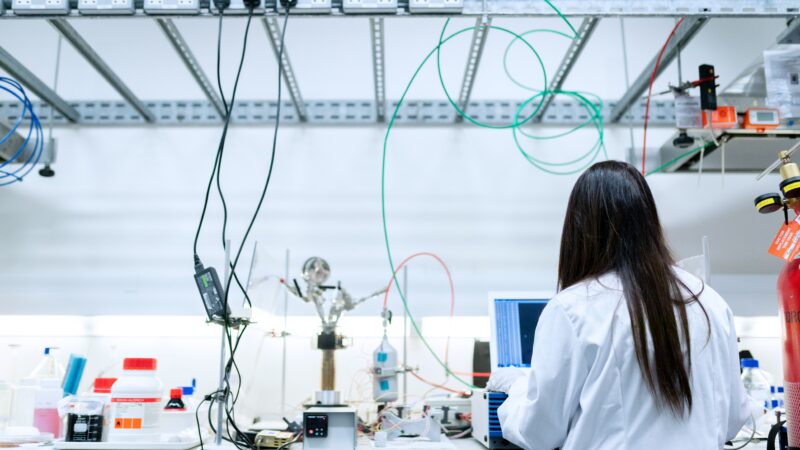 Researcher working in a technology laboratory, representing a new AI research lab