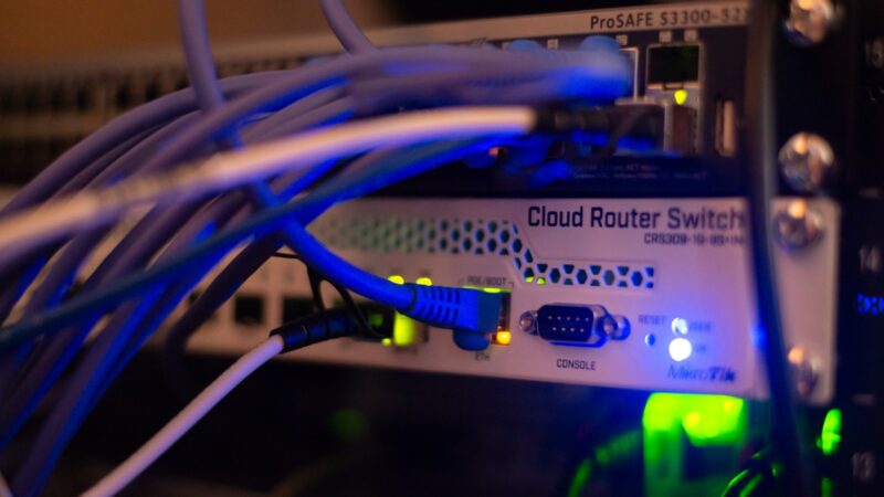 Rows of data centre servers and cooling infrastructure in a large facility.