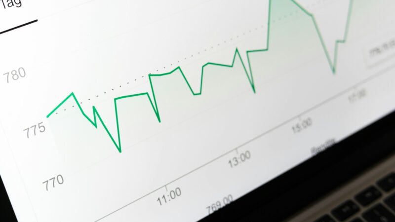Currency exchange board and cash illustrating foreign exchange costs for overseas share investing