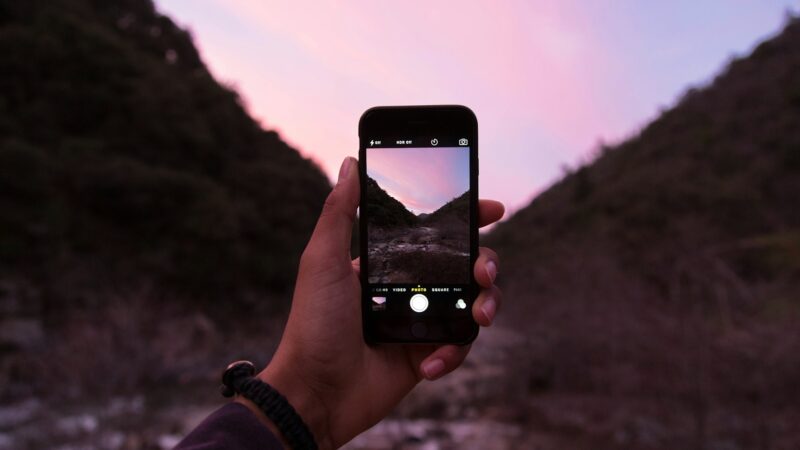 Smartphone photo editor showing AI photo editing tools and image adjustments