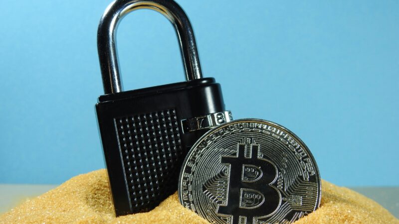 Crypto wallet graphic showing a wrapped token moving between blockchain networks.