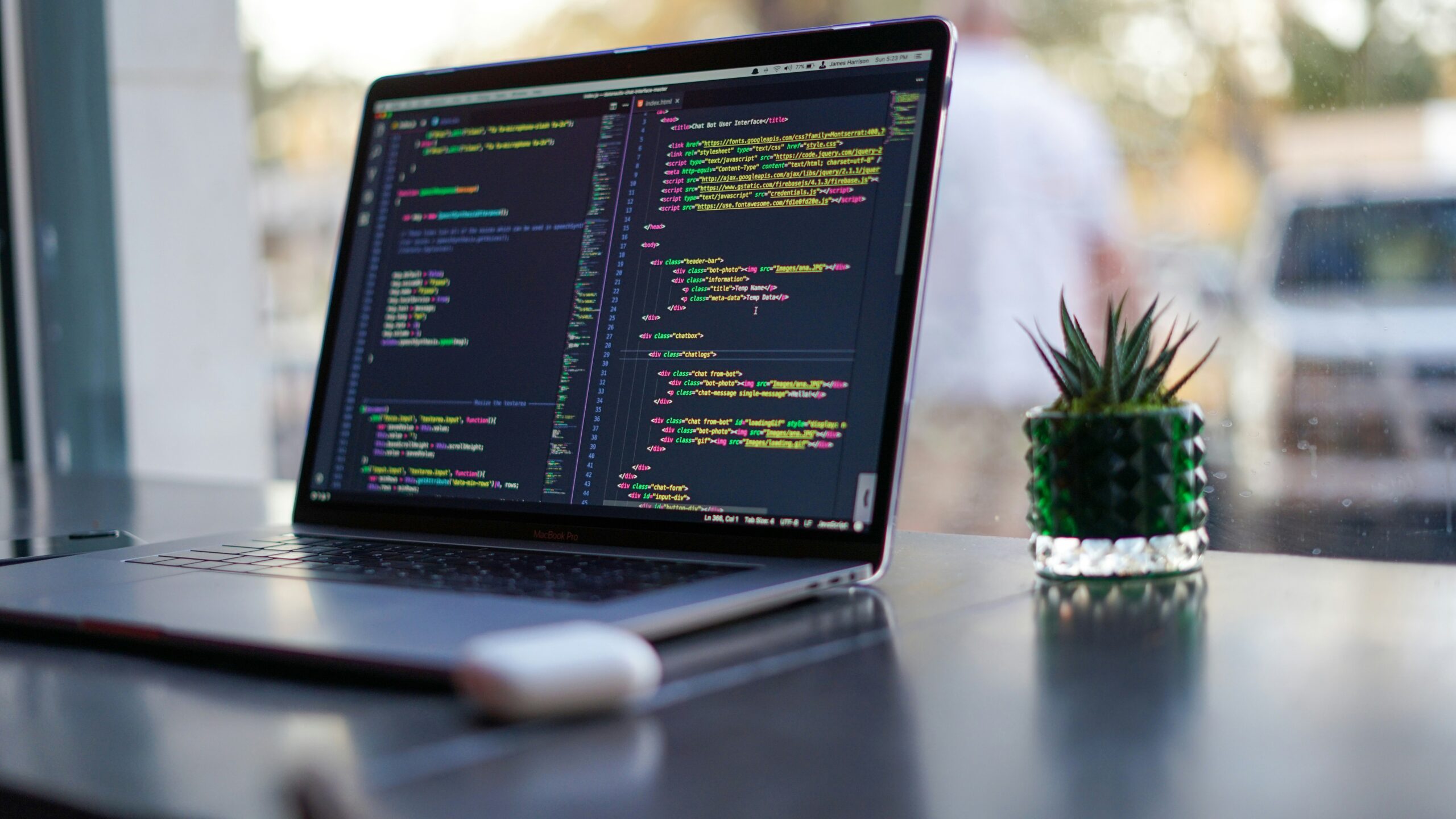 Developer laptop with code editor representing smaller AI coding model workflows