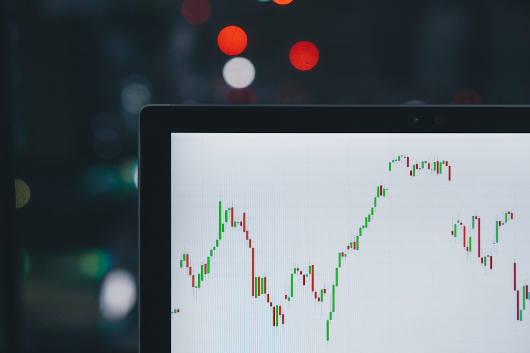 Stock lending short selling guide shown with a candlestick chart on a tablet screen