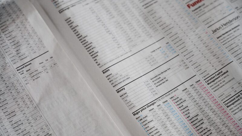 Share register small caps guide illustrated with financial newspaper share price listings
